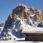 backcountry hut and skiers