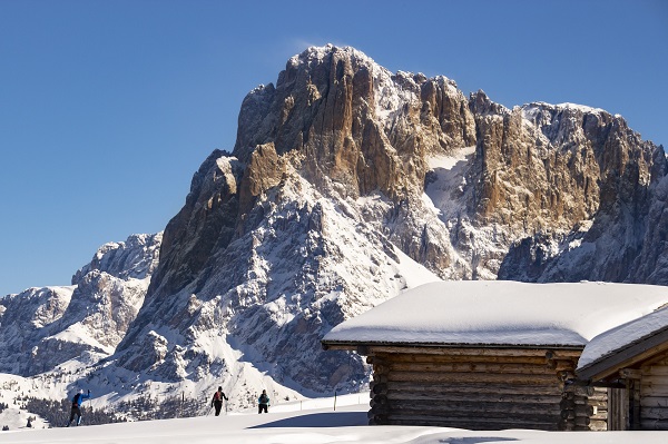 backcountry hut and skiers