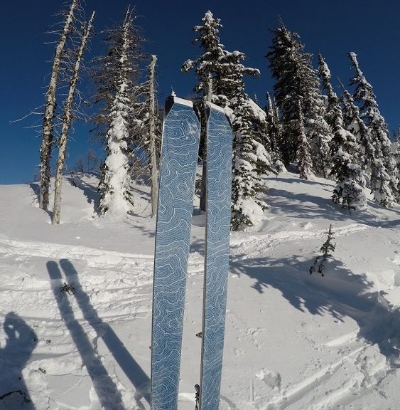 contour hybrid mix climbing skins at the top of a mountain