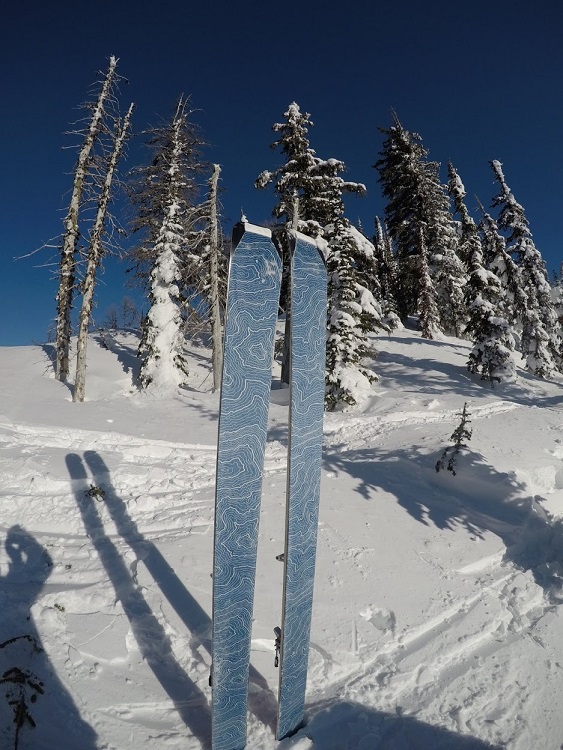 contour hybrid mix climbing skins at the top of a mountain